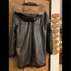 Beautiful Leather coat, reversible rabbit fur and fox trim hood.